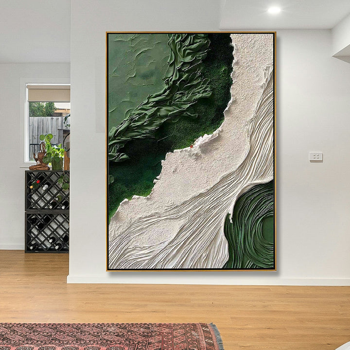 Abstract art piece with green and beige tones in a modern interior setting.