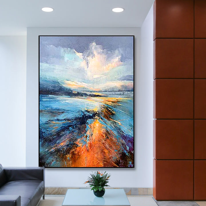 Abstract painting in a modern living room with a glass table and plant.