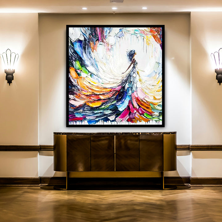 Abstract painting on a wall above a decorative console table in an elegant interior setting.