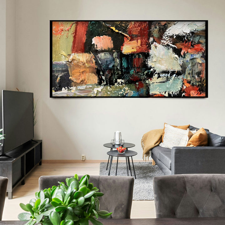 Living room with a colorful abstract painting on the wall, gray sofa, and TV.