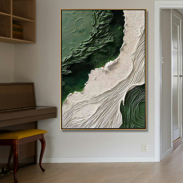 Abstract art piece in a gold frame on a wall next to a piano