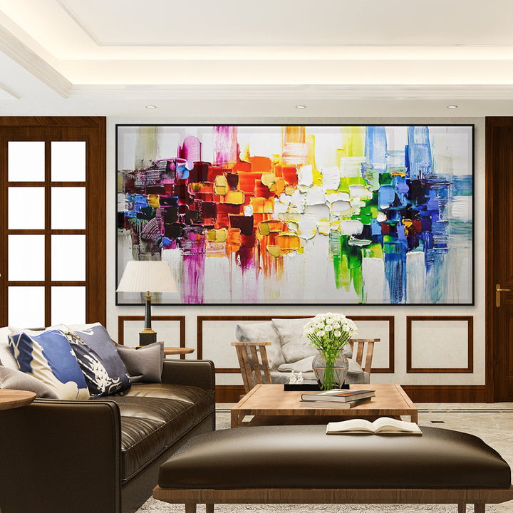 Modern living room with a colorful abstract painting on the wall.