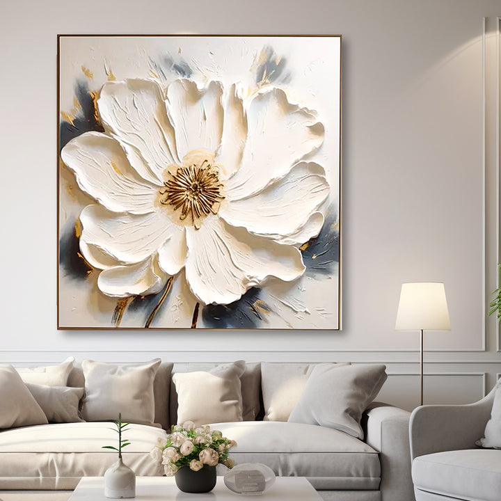Decorative floral painting on a wall above a sofa in a living room.