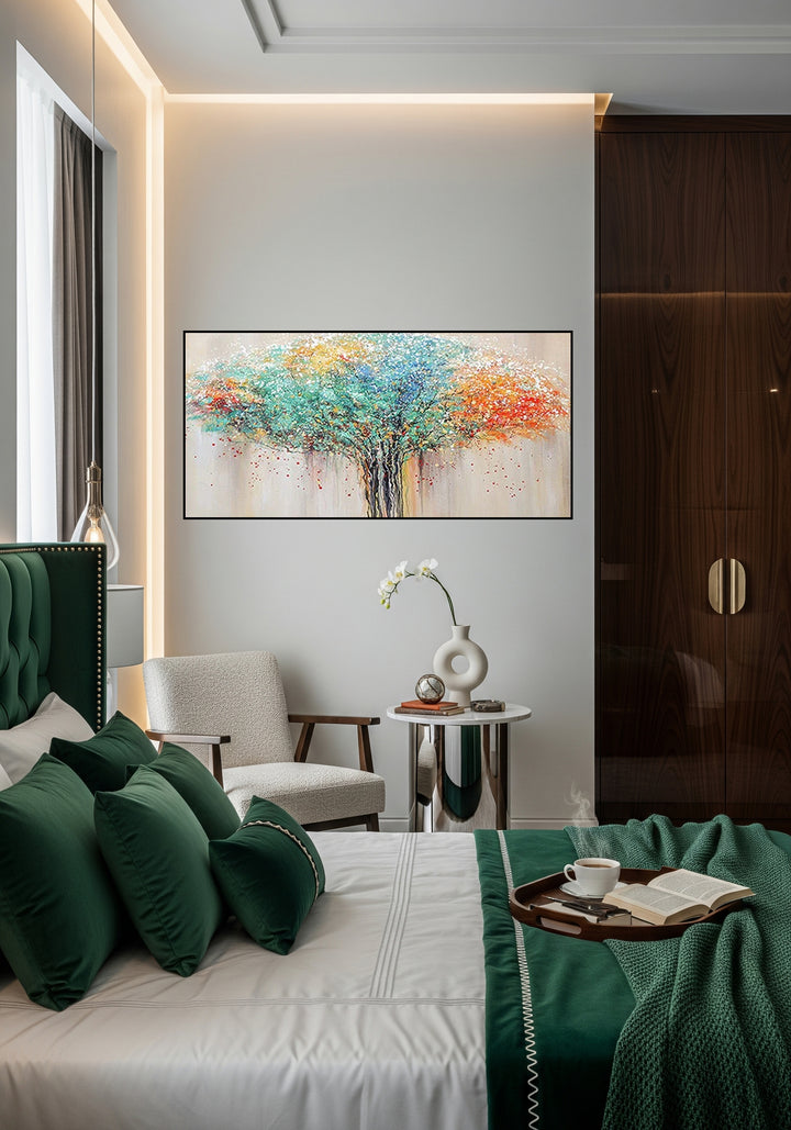 Modern bedroom with green bed, abstract tree painting, and side table.