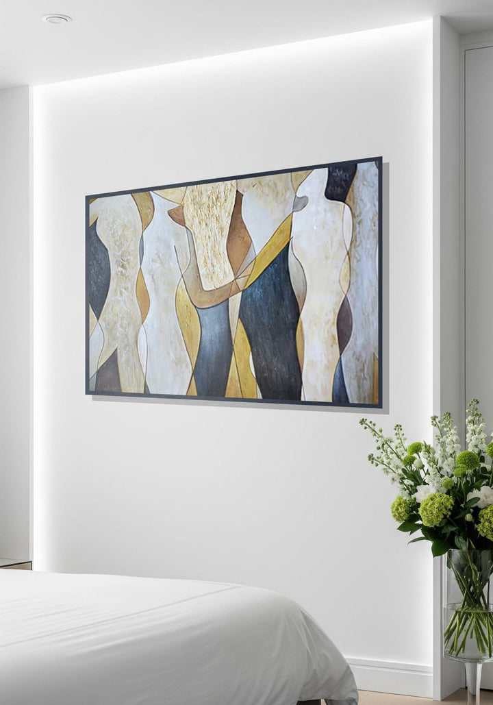 Abstract painting on a wall above a bed with a vase of flowers.