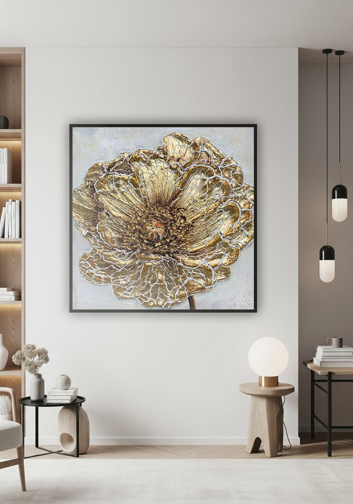Decorative gold flower wall art in a modern living room setting.