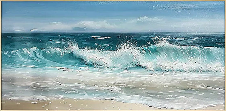 Panoramic view of a beach with ocean waves crashing onto the shore under a blue sky.